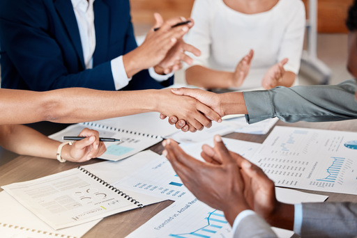 People shaking hands after getting their Mergers and Acquisitions Service in Panama
