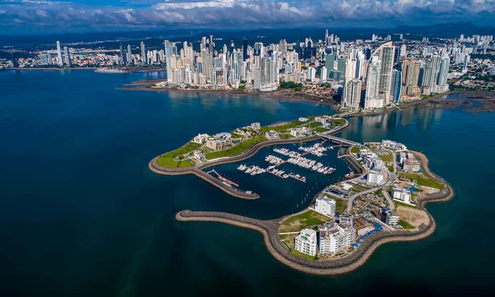 Panama City skyline at sunset. Panama City is a popular destination for real estate investment, with a growing economy and a beautiful location.