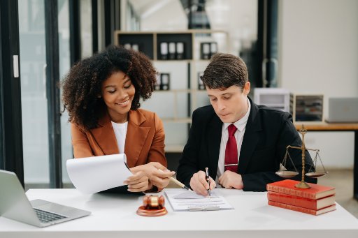 portrait of business people and lawyers discussing contract papers sitting at the table